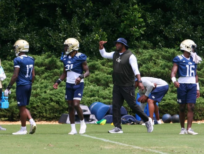 Coach Tillman working with his DBs during camp