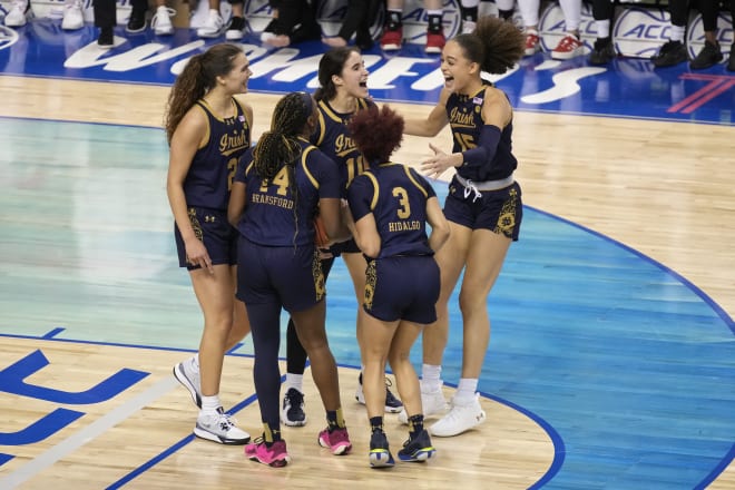 Notre Dame players start the celebration as the final seconds tick down in their 55-51 victory in the ACC Tourney Championship Game.