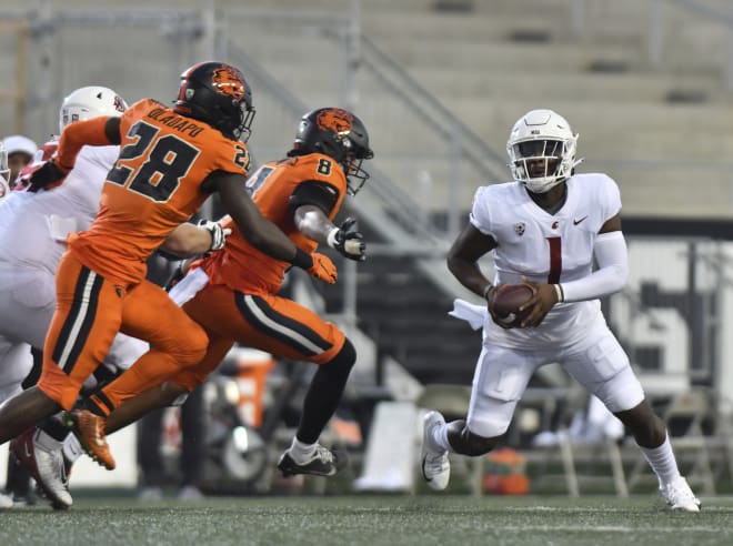 Kyrei Fisher-Morris (8) chases down WSU quarterback Cam Ward... 