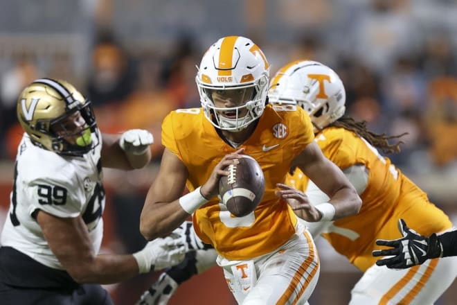 Nov 25, 2023; Knoxville, Tennessee, USA; Tennessee Volunteers quarterback Nico Iamaleava (8) scrambles with the ball against the Vanderbilt Commodores during the second half at Neyland Stadium.