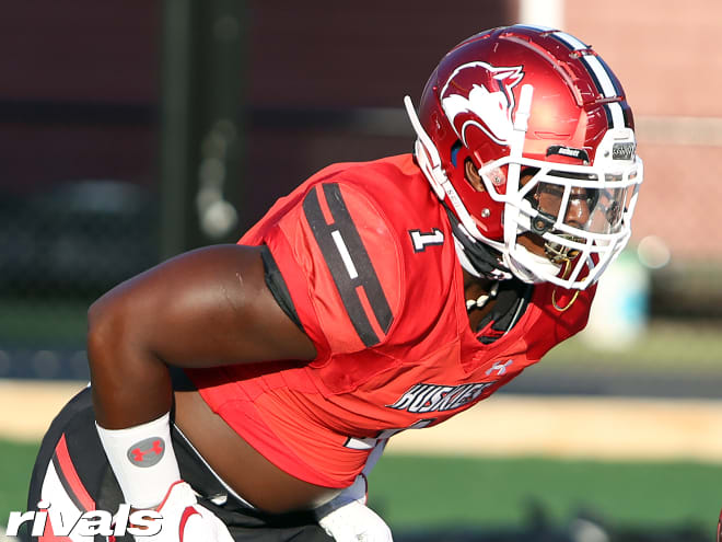 Alabama defensive lineman Justice Finkley holds a Michigan Wolverines football recruiting offer from Jim Harbaugh