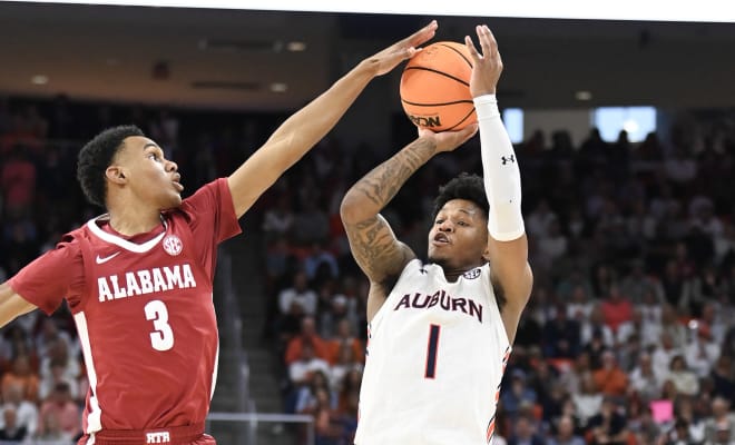 Alabama Crimson Tide guard Rylan Griffen (3) blocks a shot by Auburn Tigers guard Wendell Green Jr. (1) at Neville Arena. Photo |  Julie Bennett-USA TODAY Sports