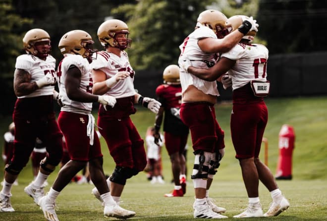 Redshirt junior center Jackson Ness celebrates with his offensive line and true freshman tight end Jeremiah Franklin after a touchdown in fall camp (Photo courtesy of BC Football).