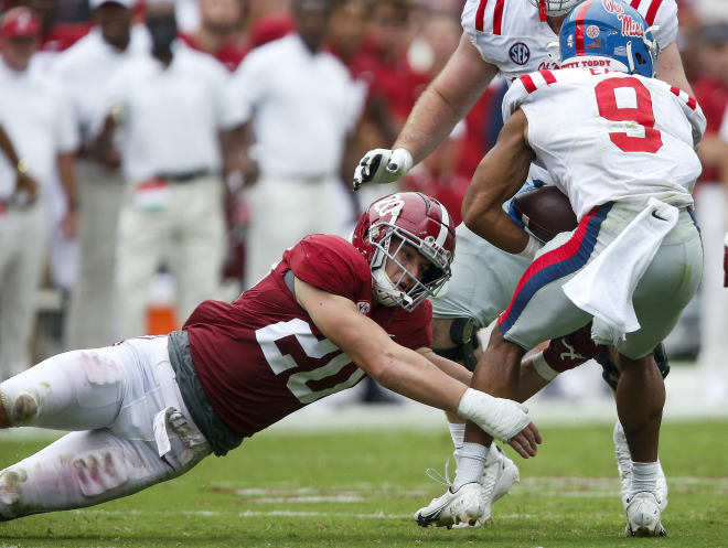 Alabama Crimson Tide linebacker Drew Sanders (20) makes a tackle against Ole Miss. Photo | USA TODAY