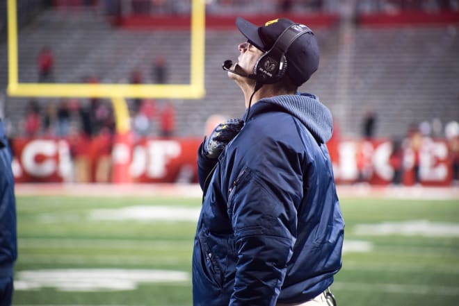 Michigan Wolverines football head coach Jim Harbaugh continues to work on an extension