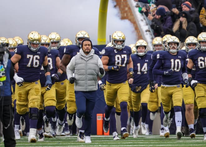Notre Dame first-year head coach Marcus Freeman leads his team onto the field in what turned out to be a triumphant Senior Day.
