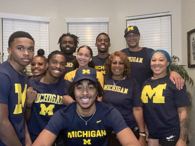 Michigan Wolverines basketball commit Frankie Collins and his family celebrate his commitment, decked out in Maize and Blue.