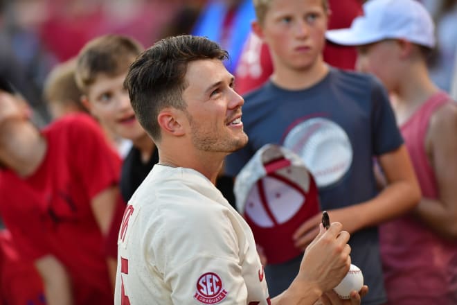 Kevin Kopps signed autographs well after Arkansas was eliminated Sunday night.