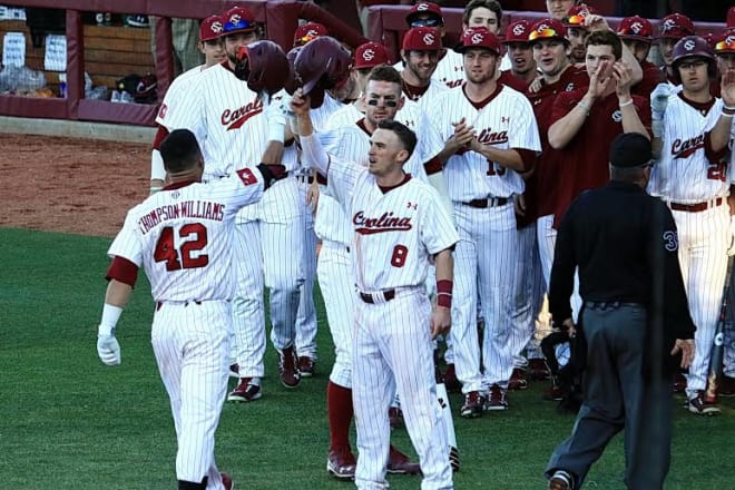 Dom Thompson Williams is greeted by his teammates after hitting a HR in Friday's game