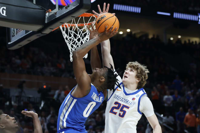 Memphis guard Earl Timberlake (0) puts up a shot against Boise State center Lukas Milner (25) during the second half of a first round NCAA college basketball tournament game, Thursday, March 17, 2022, in Portland, Ore.