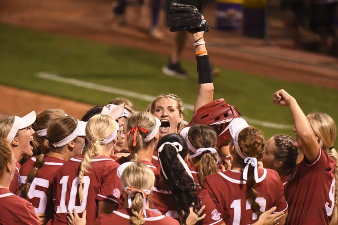 Montana Fouts yells in triumph with her teammates Saturday, May 27, 2023, at Rhoads Stadium in Tuscaloosa. Alabama defeated Northwestern 2-1 to force a deciding third game Sunday. Photo | Gary Cosby Jr.-Tuscaloosa News / USA TODAY NETWORK