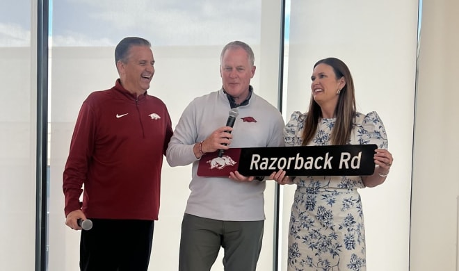 Arkansas AD Hunter Yurachek (middle) with head men's basketball coach John Calipari (left) and Arkansas governor Sarah Huckabee Sanders (right) in Little Rock on Tuesday. 