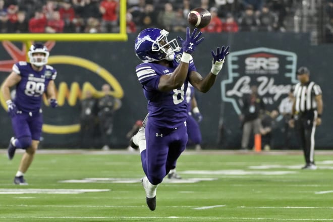 AJ Henning leaps to make a catch on Northwestern's game-winning, fourth-quarter touchdown drive.