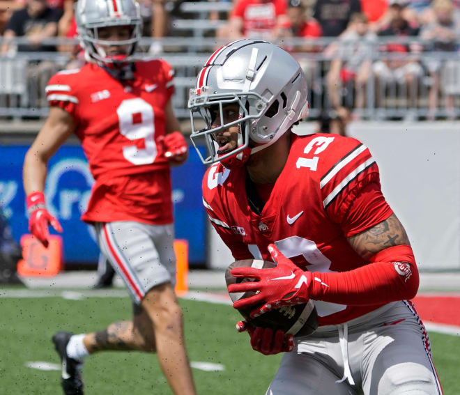 Wide receiver Kaleb Brown, right, announced his transfer from Ohio State to Iowa on Thursday.