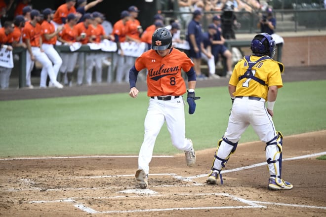 Auburn third baseman Bryan Ware scores the final run in AU's six-run first inning that eventually propelled the home team to a 12-2 eighth-inning run-rule win over No. 1 LSU on Sunday to win the three-game SEC weekend series.