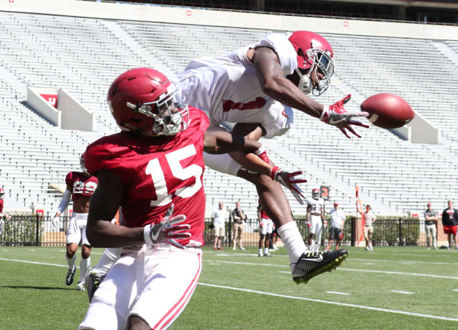 Alabama receiver Robert Foster goes up for a catch against safety Ronnie Harrison in the Crimson Tide's first scrimmage of spring camp. Photo | Alabama Athletics