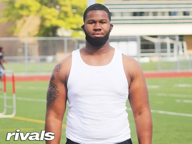 Rivals100 defensive lineman Rayshaun Benny holds a Michigan Wolverines football recruiting offer from Jim Harbaugh.