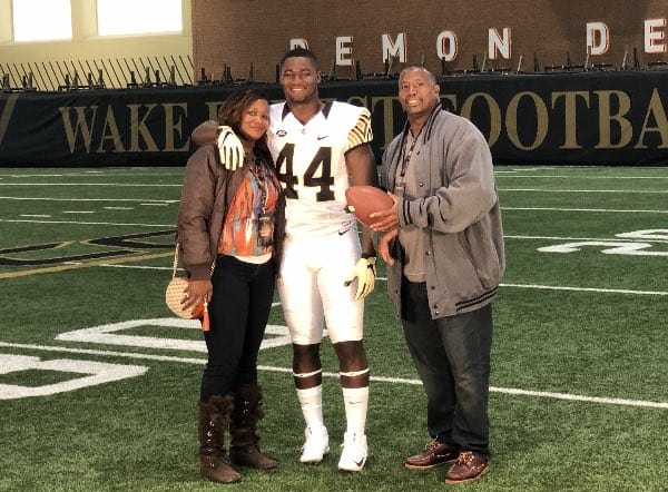 Williams poses with his family during his official visit last week