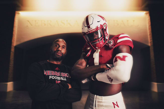 NU receivers coach Troy Walters with JUCO WR Omar Manning.