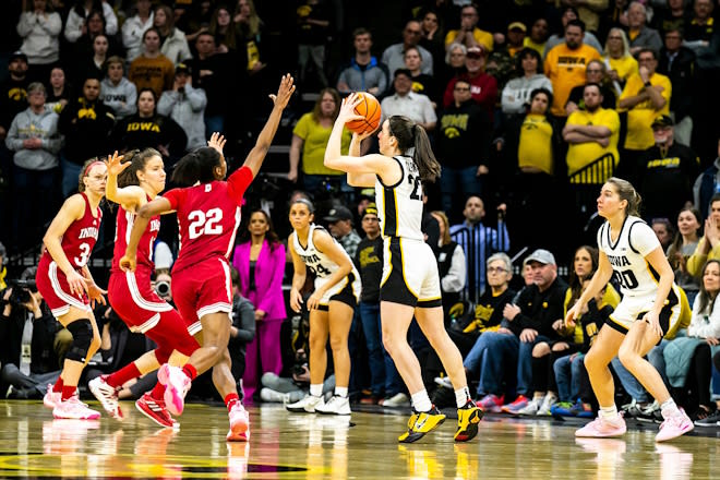 Iowa guard Caitlin Clark (22) makes the game-winning 3-point basket during a NCAA Big Ten Conference women's basketball game against Indiana, Sunday, Feb. 26, 2023, at Carver-Hawkeye Arena in Iowa City, Iowa.