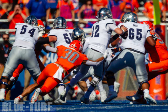 Boise State redshirt sophomore, Isaiah Bagnah (30) drags down Nevada QB, Carson Strong (12) for a sack. One of three sacks Bagnah had on the day.