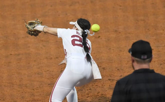 A poor throw to first gets past Alabama infielder Kali Heivilin (22) who was covering on a bunt against Northwestern during the Super Regional game Friday, May 26, 2023, at Rhoads Stadium in Tuscaloosa. Photo | Gary Cosby Jr.-Tuscaloosa News / USA TODAY NETWORK