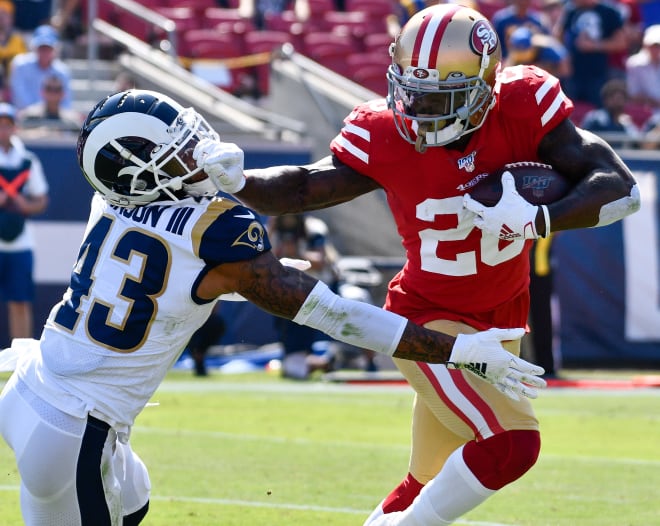 San Francisco 49ers running back Tevin Colman stiff arms a Los Angeles Rams defender before scoring a touchdown on Sunday, Oct. 13, 2019. (USA Today Images)