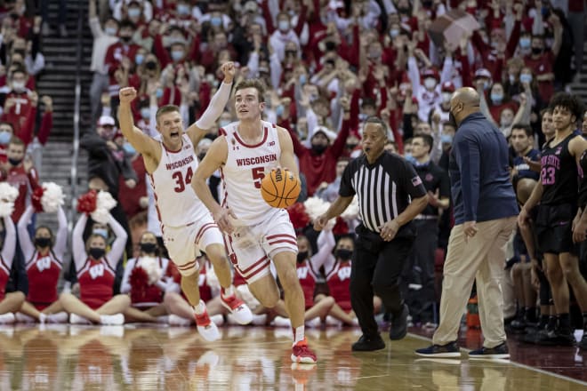 Tyler Wahl (5) grabs the final rebound as Brad Davison (34) celebrates Wisconsin's win against Penn State Feb.5