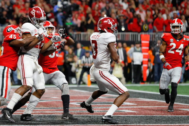 Alabama receiver Calvin Ridley (3) catches a game-tying touchdown pass in the fourth quarter of the Crimson Tide's 26-23 overtime win against Georgia in the national championship game. Photo | Getty Images