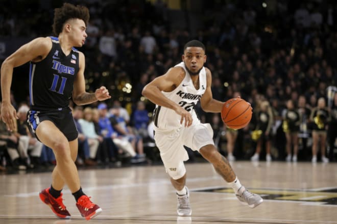 UCF guard Darin Green Jr. drives around Memphis guard Lester Quinones during the second half at Addition Financial Arena. (Reinhold Matay-USA TODAY Sports)