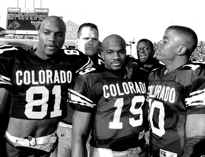 Michael Westbrook, Rashaan Salaam and Kordell Stewart — three key members of CU's 27-26 comeback, last second victory on the road at Michigan on Sept. 24, 1994, pose at Folsom Field after beating Iowa State in the 1994 regular season finale.