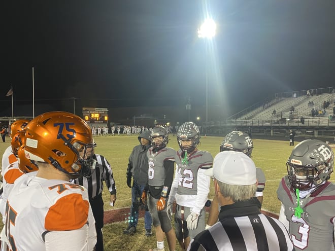 Captains from Manchester and Thomas Dale meet at midfield prior to Friday night's Region 6A semi-final