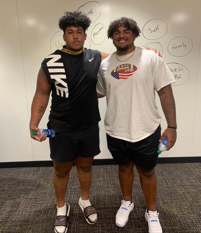 Kadyn Proctor with former Hawkeye Tristan Wirfs in Iowa City today.