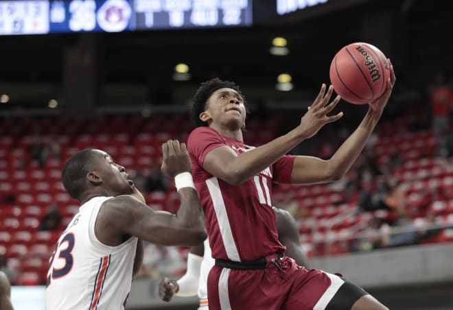 Alabama Crimson Tide guard Joshua Primo (11) goes for a shot as Auburn Tigers forward Jaylin Williams (23) defends during the second half at Auburn Arena. Photo | Imagn