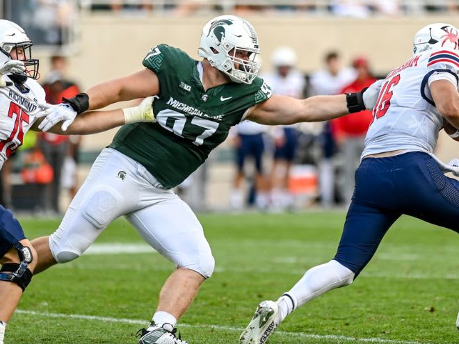 Michigan State defensive lineman Maverick Hansen pressures Richmond quarterback Kyle Wickersham on Sept. 9, 2023.