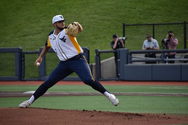 Former West Virginia Mountaineers right-handed pitcher Alek Manoah throws a pitch during a game against George Washington last season (Photo by Patrick Kotnik).