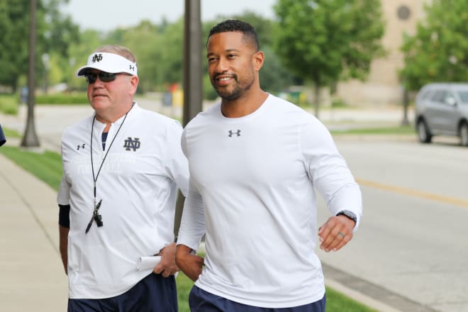 Notre Dame Fighting Irish football head coach Brian Kelly and defensive coordinator Marcus Freeman