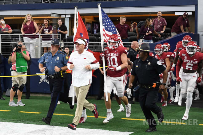 Chad Morris runs onto the field at AT&T Stadium before a game against Texas A&M.