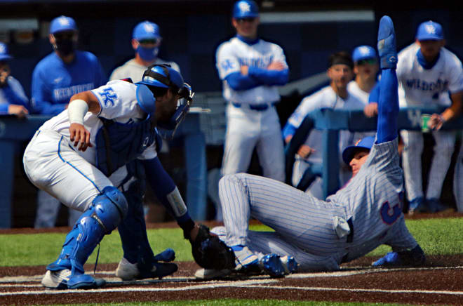 Florida's Kris Armstrong slid home safely ahead of the tag from Kentucky catcher Coltyn Kessler during Saturday's series finale at Kentucky Proud Prark.