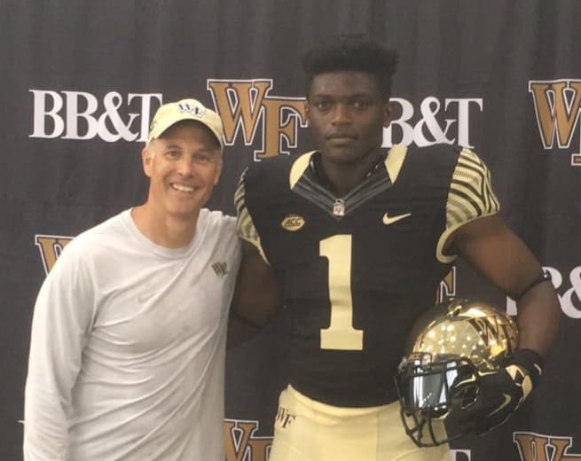 Boletepeli poses with Dave Clawson during his visit to Wake Forest in mid-June
