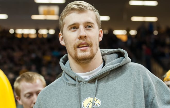 Iowa quarterback C.J. Beathard watches the Iowa basketball game on Sunday.