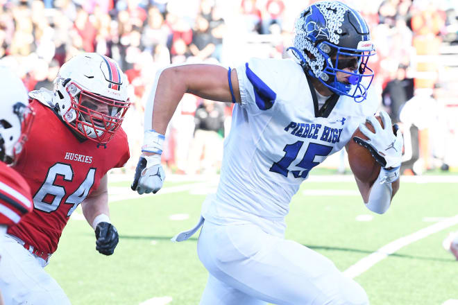 There was a lot of this Tuesday afternoon, Pierce senior Ben Brahmer (15) catching a pass and running a long ways. Pierce beat Aurora, 42-12, for the Class C-1 state championship.