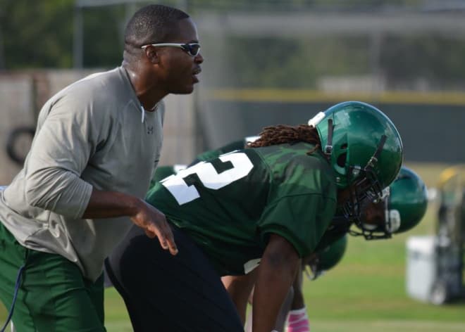 Lanier Goethie (left) coaching linebackers at Delta State