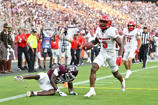 New Mexico Lobos running back Jacory Croskey-Merritt (5) runs the ball in for a touchdown during the second quarter against the Texas A&M Aggies at Kyle Field. Mandatory Credit: Maria Lysaker-USA TODAY Sports