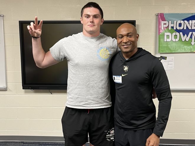 2025 Army commit Michael Goodale with Army CB Coach Daryl Dixon during recent in-school visit