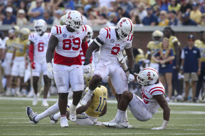 Ole Miss Rebels defensive end Cedric Johnson (2) celebrates after a tackle with defensive tackle JJ Pegues (89) and defensive end Tavius Robinson (95) against the Georgia Tech Yellow Jackets in the... Brett Davis-USA TODAY Sports