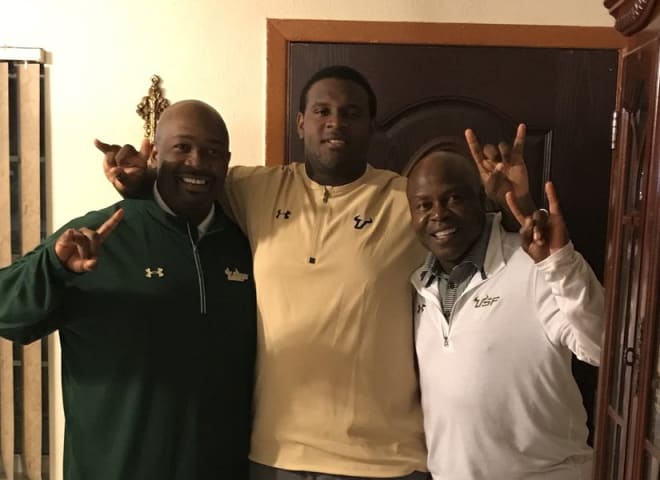 Coach Shaun King, Waller and coach Charlie Williams from USF doing an in-home with Waller 