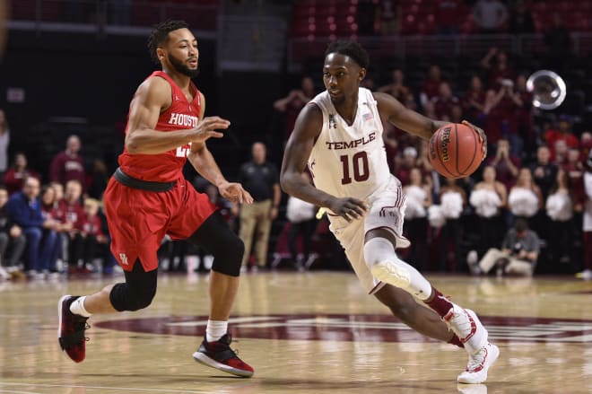 Temple Owls guard Shizz Alston Jr. dribbles past Houston Cougars guard Galen Robinson Jr. during the second half at Liacouras Center.