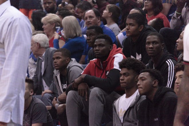 Issac McBride (white adidas t-shirt) has committed to Kansas