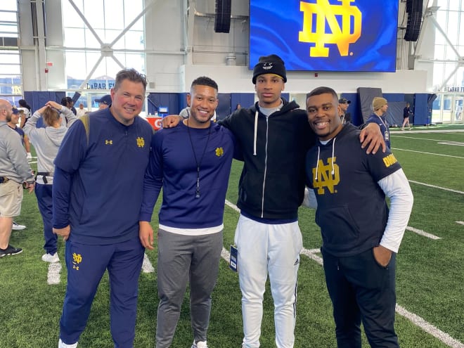 From left to right: Notre Dame defensive coordinator Al Golden, head coach Marcus Freeman, 2025 safety recruit JaDon Blair and defensive backs coach Mike Mickens.